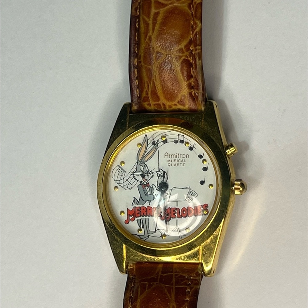 (201)Armitron Gold Musical Quartz Watch with Brown Leather Strap